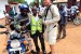 Bobo handing me off to another moto-taxi in Kimmi, Sierra Leone